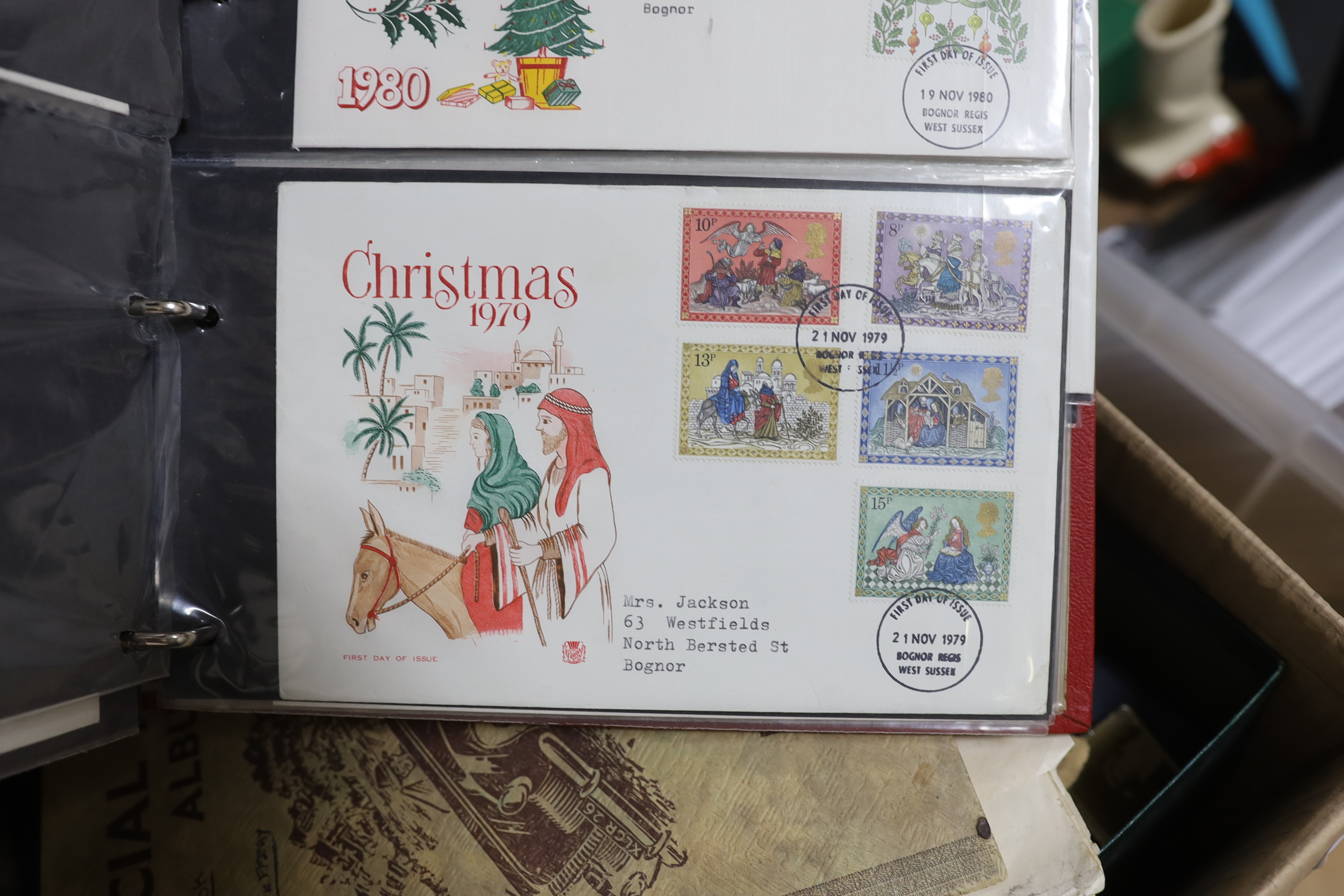 A collection of world stamps, some arranged in albums